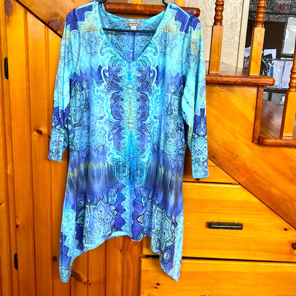 Three quarter sleeve tunic, embellished with in the front.
